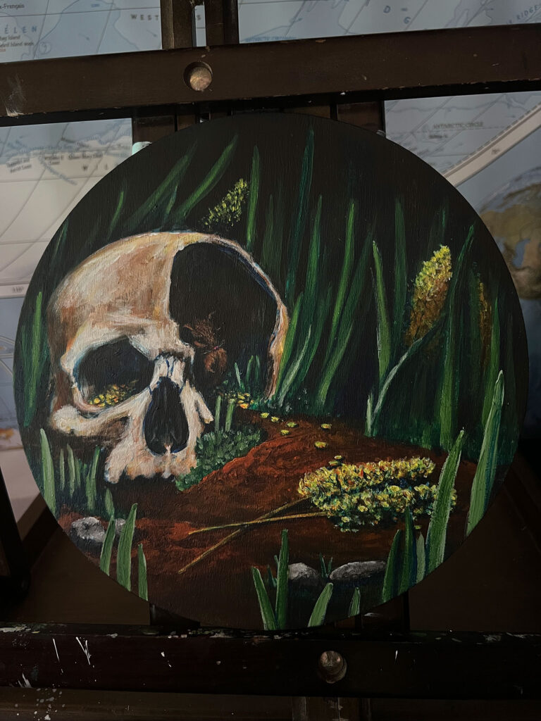Painting of a skull with a mouse taking shelter inside it.